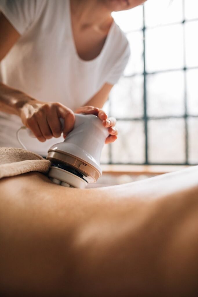 Relaxing body massage therapy session using an innovative electronic device indoors.